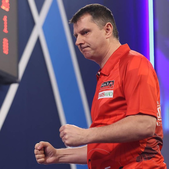 William Hill World Darts Championship 27/12/2020. Krzysztof Ratajski celebrates winning the first set during the third round of the William Hill World Darts Championship at Alexandra Palace, London, U ...