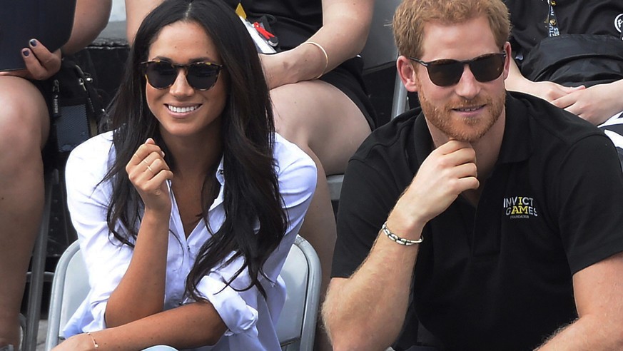 Prince Harry and his girlfriend Meghan Markle attend a wheelchair tennis event at the Invictus Games in Toronto, Monday, Sept. 25, 2017. (Nathan Denette/The Canadian Press via AP)