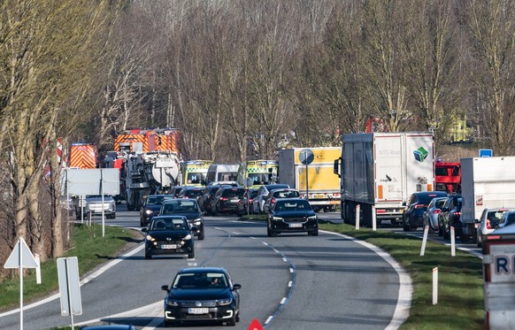 epa12908391 Motorists wait in traffic jams caused after two trains collided between Hilleroed and Kagerup at Isteroedvejen, Denmark, 23 April 2026. There are reports of personal injuries, according to ...