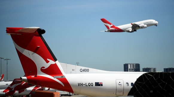 epa08305423 A Qantas aircraft takes off from Sydney Airport in Sydney, Australia, 19 March 2020. According to media reports on 19 March 2020, Qantas has suspended all international flights and will st ...