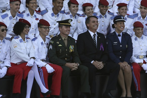 Brazilian congressman Jair Bolsonaro poses for photos with soldiers and cadets during a a ceremony commemorating Army Day, in Brasilia, Brazil, Wednesday, April 19, 2017. Bolsonaro, a potential presid ...