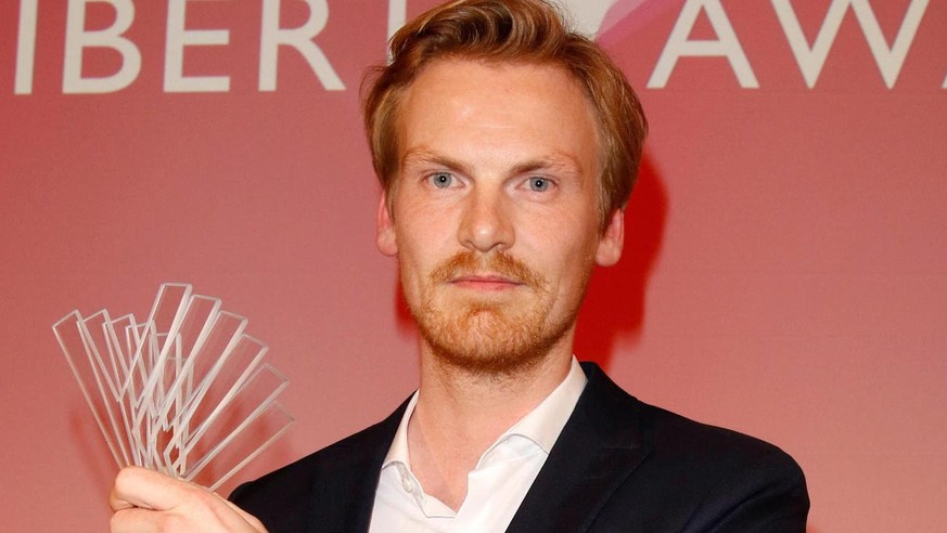 epa07241842 German journalist Claas Relotius holds his award trophy of the Reemtsma Liberty Award, a German journalist award, in Berlin, Germany, 22 March 2017 (issued 20 December 2018). German weekly ...