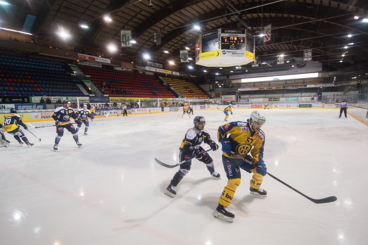 Ambri's player Fabio Hofer left fight for the puck with Davos's player Davyd Baradun righ, during the preliminary round game of National League A (NLA) Swiss Championship 2019/20 between HC  ...