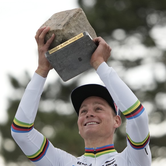 Netherland&#039;s Mathieu van der Poel poses on the podium after winning the men&#039;s Paris Roubaix, a 260 kilometer (162 miles) one-day-race, at the velodrome in Roubaix, northern France, Sunday, A ...