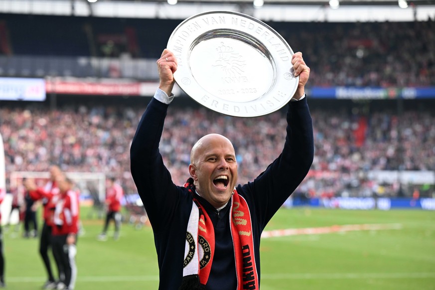 epa10628190 Feyenoord coach Arne Slot celebrates with the trophy after the Dutch Eredivisie match between Feyenoord Rotterdam and Go Ahead Eagles, in Rotterdam, Netherlands, 14 May 2023. Feyenoord sea ...