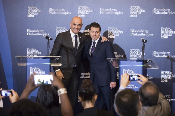 epa07049343 Swiss Federal President Alain Berset (L) and Mexico&#039;s President Enrique Pena Nieto (R) react after a press conference at the Bloomberg Global Business Forum in New York, New York, USA ...