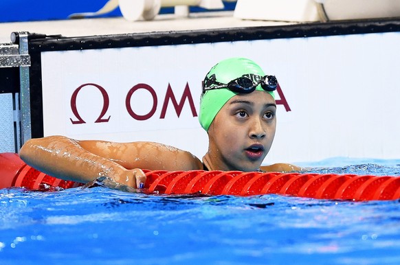 epa05461885 Gaurika Singh of Nepal reacts during the women's 100m Backstroke heats of the Rio 2016 Olympic Games Swimming events at Olympic Aquatics Stadium at the Olympic Park in Rio de Janeiro, Brazil, 07 August 2016. Singh, 13 years old, is the youngest competitor at the Rio 2016 Olympic Games.  EPA/DAVE HUNT AUSTRALIA AND NEW ZEALAND OUT