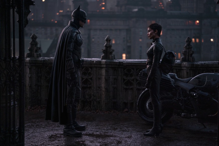 This image released by Warner Bros. Pictures shows Robert Pattinson, left, and Zoe Kravitz in a scene from &quot;The Batman.&quot; (Jonathan Olley/Warner Bros. Pictures via AP)
