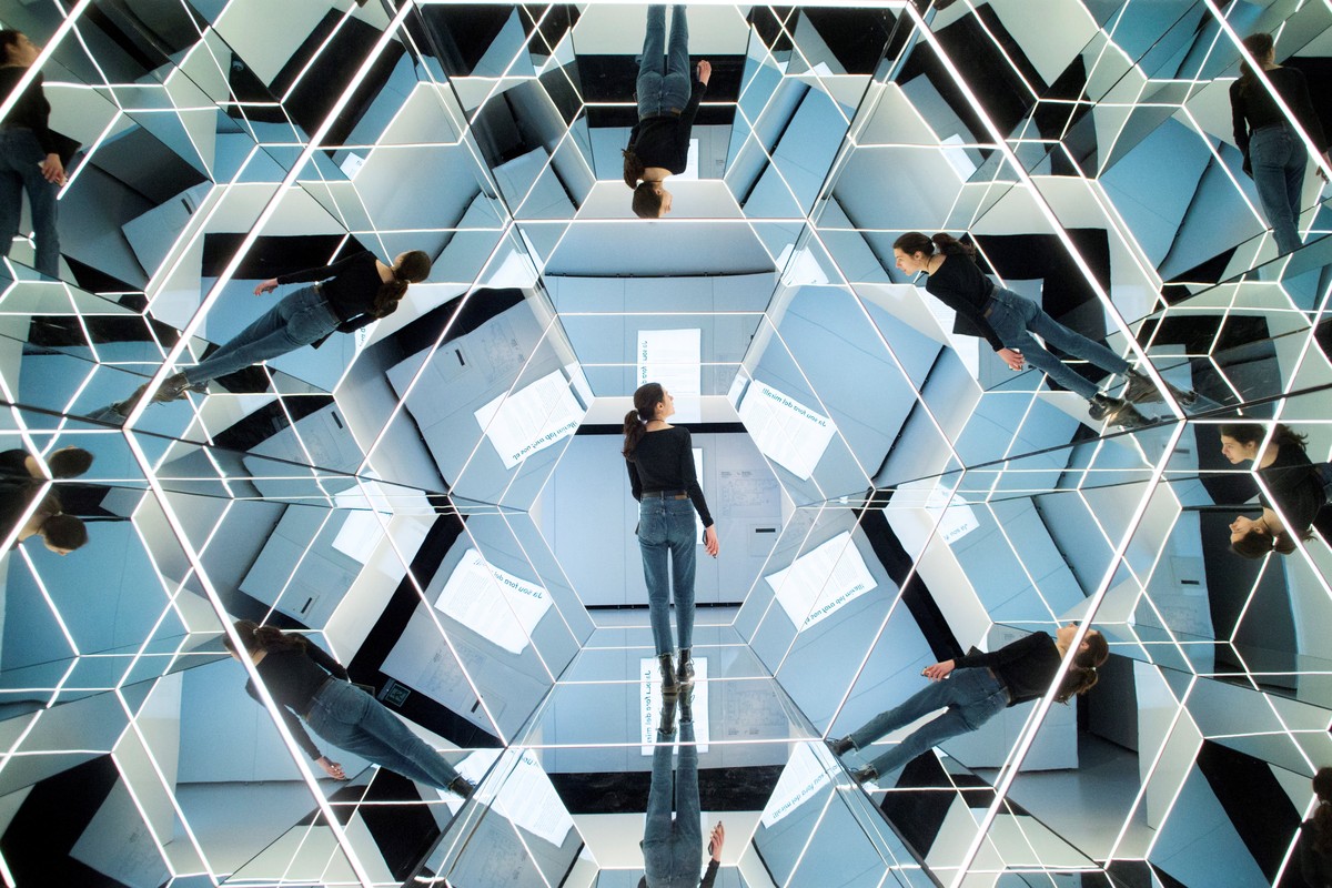 epa07501215 A woman visits the exhibition 'Mirrors: In and Out of Reality' in Barcelona, Spain, 12 April 2019. Maths, physics and photonics melt in this exhibition presented by Cosmocaixa in ...
