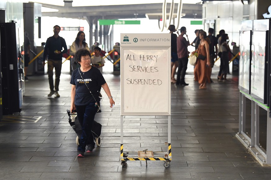 epa08058635 A view of a notice about ferry services at Circular Quay after services were cancelled as smoke and haze from bushfires in New South Wales blankets the CBD in Sydney, Australia, 10 Decembe ...