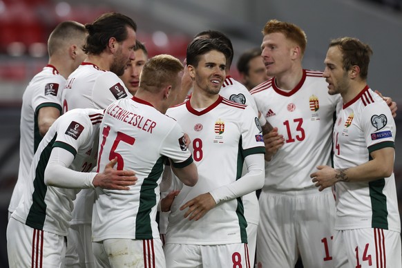 Hungary players celebrates after Hungary's Roland Sallai scored his side's opening goal during the World Cup 2022 group I qualifying soccer match between Hungary and Poland at the Puskas Are ...