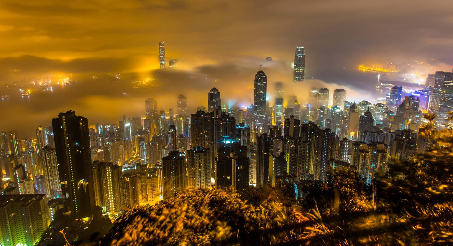 PIC FROM KWAN SIMON / CATERS NEWS - (PICTURED: The incredible city scape of Hong Kong taken from The Peak ) - It might look like this is a city floating on clouds - but these incredible photos actuall ...