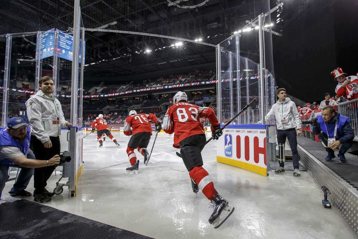Switzerland's players defender Michael Fora #45, defender Joel Genazzi #76 and forward Joel Vermin #83, arrive on rink, prior the IIHF 2018 World Championship preliminary round game between Switz ...