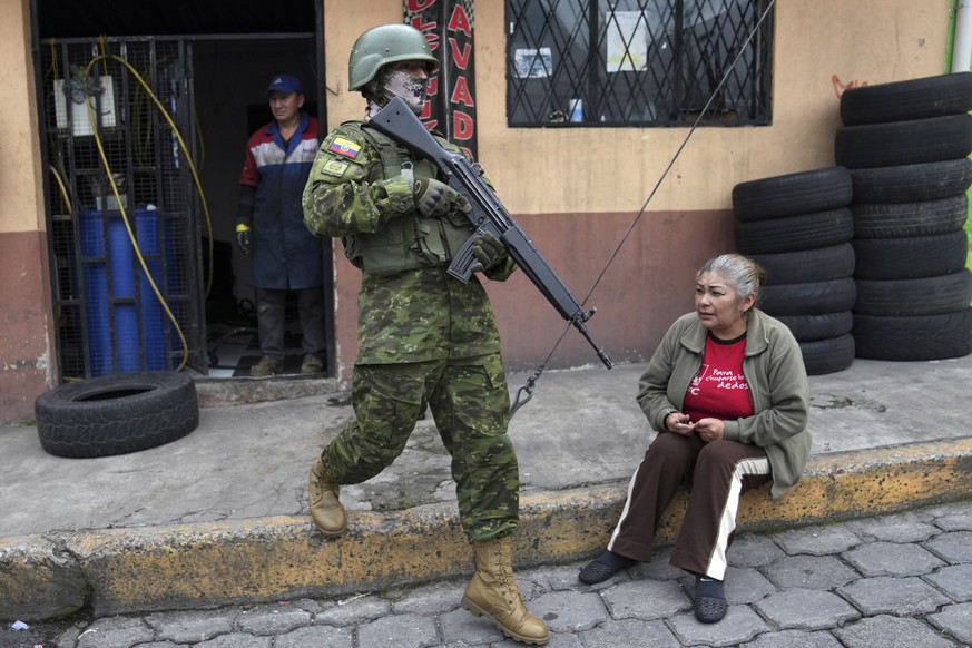 Soldiers patrol a residential neighborhood on the south side of Quito, Ecuador, Friday, Jan. 12, 2024, in the wake of a powerful gang leader's apparent escape from prison.  President Daniel Noboa has decided...