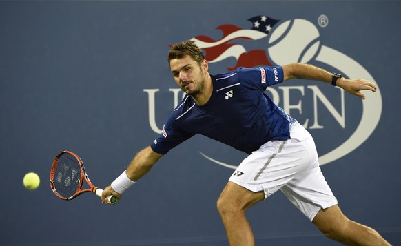 Stan Wawrinka, of Switzerland, returns the ball against Ruben Bemelman,s of Belgium, in the third round at the U.S. Open tennis tournament on Saturday, Sept. 5, 2015, in New York. Wawrinka won in thre ...