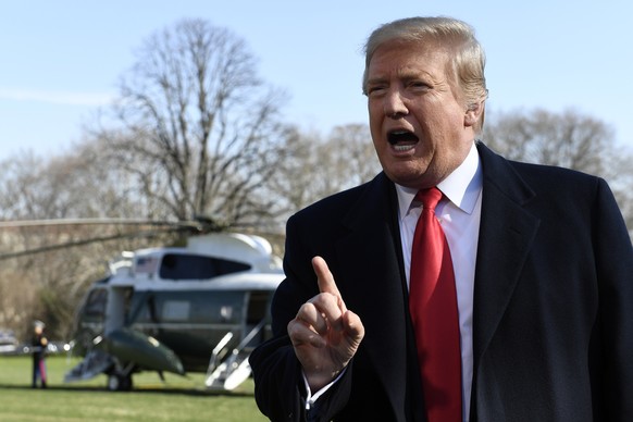 President Donald Trump talks with reporters before boarding Marine One on the South Lawn of the White House in Washington, Thursday, March 28, 2019, for the short trip to Andrews Air Force Base in Mar ...