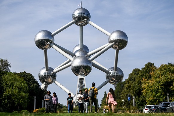 epa11576188 Tourists visit the Atomium in Brussels, Belgium, 31 August 2024. Brussels' iconic monument, Atomium, was built as the centerpiece of the 1958 Brussels World's Fair. The landmark, ...