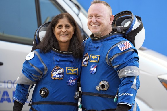 FILE - NASA astronauts Suni Williams, left, and Butch Wilmore stand together for a photo enroute to the launch pad at Space Launch Complex 41 Wednesday, June 5, 2024, in Cape Canaveral, Fla., for thei ...
