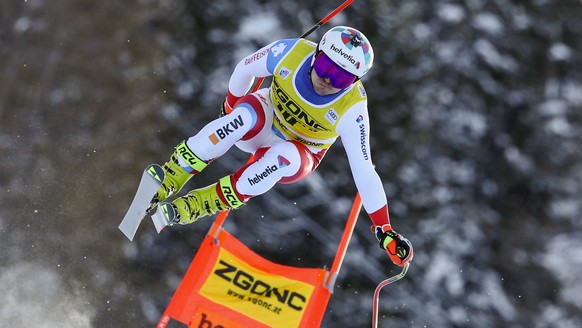 Switzerland's Urs Kryenbuehl speeds down the course during an alpine ski, men's World Cup downhill, in Bormio, northern Italy, Wednesday, Dec. 30, 2020. (AP Photo/Marco Trovati)