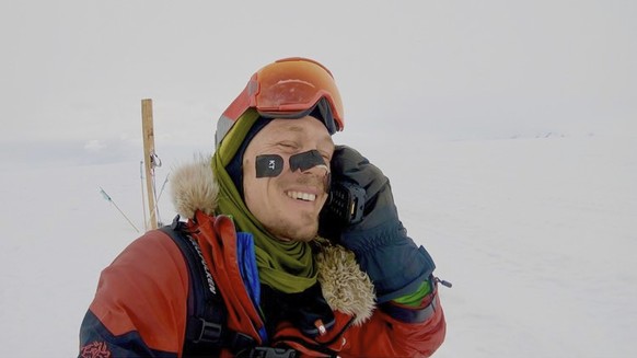 In this photo provided by Colin O&#039;Brady, of Portland., Ore., he speaks on the phone in Antarctica on Wednesday, Dec. 26, 2018. He has become the first person to traverse Antarctica alone without  ...