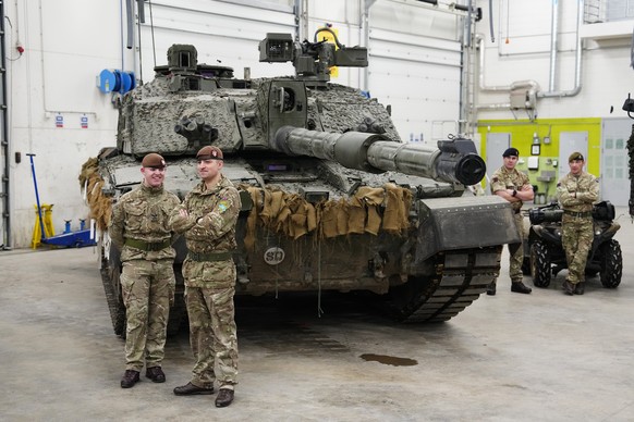 Britain's military officers stand next to a Challenger 2 tank at the Tapa Military Camp, in Estonia, Thursday, Jan. 19, 2023. Britain's Defence Minister Ben Wallace said his country would send at leas ...