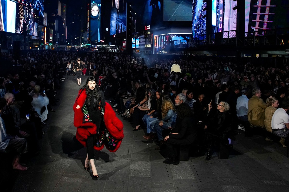 A model presents a creation from the Gucci Cruise 2027 collection at Times Square in New York City, U.S., May 16, 2026. REUTERS/Eduardo Munoz