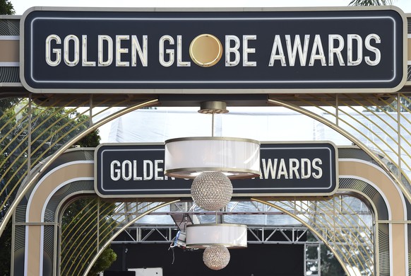 FILE - Event signage appears above the red carpet at the 77th annual Golden Globe Awards, on Jan. 5, 2020, in Beverly Hills, Calif. The Hollywood Foreign Press Association on Thursday announced reform ...