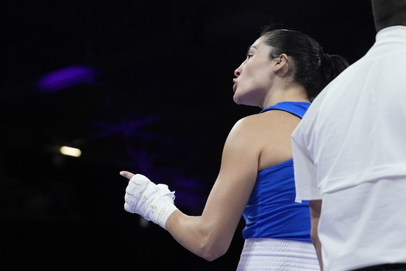 Italy&#039;s Angela Carini speaks with her corner in after abandoning her fight against Algeria&#039;s Imane Khelif in their women&#039;s 66kg preliminary boxing match at the 2024 Summer Olympics, Thu ...