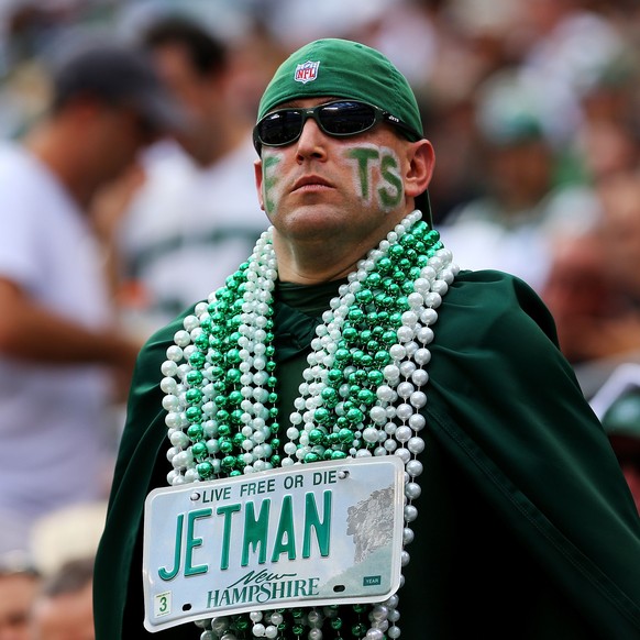 EAST RUTHERFORD, NJ - SEPTEMBER 07: A New York Jets fan watches the action during the second quarter of a game against the Oakland Raiders at MetLife Stadium on September 7, 2014 in East Rutherford, N ...