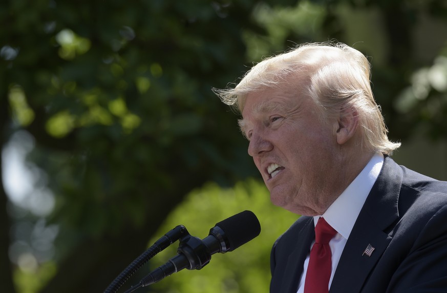 President Donald Trump announces that the U.S. will withdraw from the Paris climate change accord, Thursday, June 1, 2017, in the Rose Garden of the White House in Washington. (AP Photo/Susan Walsh)