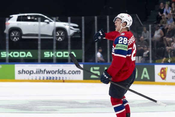 epa12995131 Norway's Michael Brandsegg-Nygard, celebrates the winning goal (4-3) in overtime, during the 2026 IIHF Men's Ice Hockey World Championship preliminary round group B game between  ...