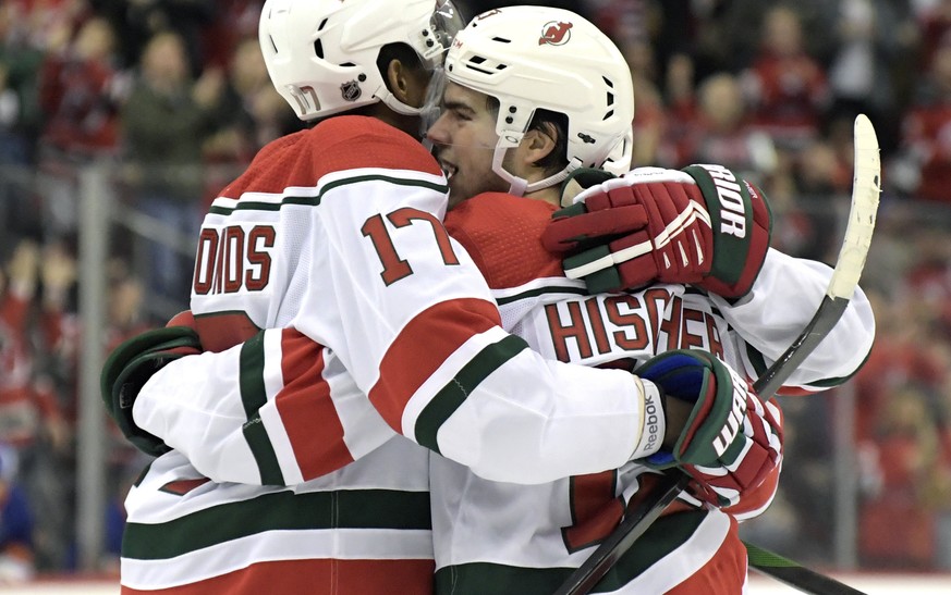 New Jersey Devils center Nico Hischier (13) celebrates his goal with right wing Wayne Simmonds (17) during the second period of an NHL hockey game against the New York Islanders, Tuesday, Jan. 7, 2020 ...