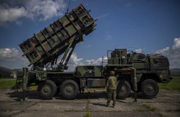 epa09937877 A German soldier looks on as he shows how it works at the launching station of NATO&#039;s Patriot missile air defense system operated by German army unit Flugabwehrraketengruppe 26 (Air D ...