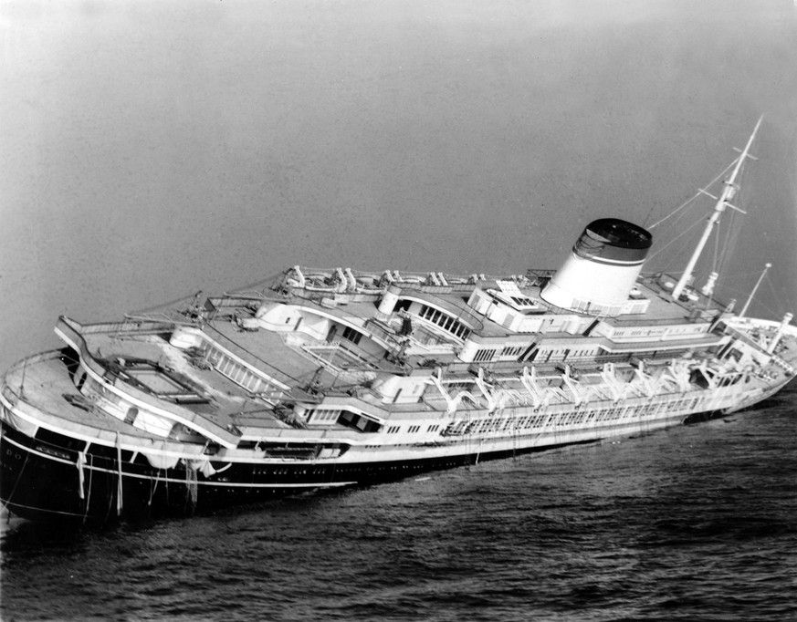 FILE - In this July 26, 1956 file photo, the Italian luxury liner Andrea Doria keels far over to starboard before sinking 225 feet to the bottom of the Atlantic 45 miles off Nantucket Island, Mass. Ne ...