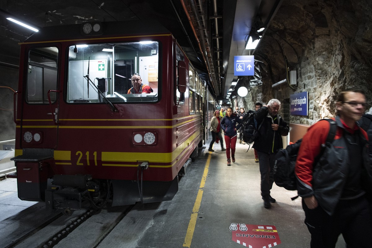 epa08468444 Tourists arrive during the coronavirus disease (COVID-19) outbreak on Saturday, 6 June 2020, on the Jungfraujoch, Switzerland. The Jungfrau railway reopened on 6 June. From 6 June, Switzer ...