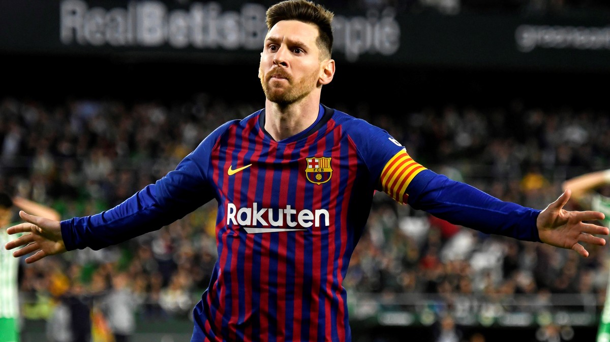 epa07446018 FC Barcelona's Lionel Messi celebrates after scoring the 4-1 lead during the Spanish La Liga soccer match between Real Betis and FC Barcelona in Seville, southern Spain, 17 March 2019 ...
