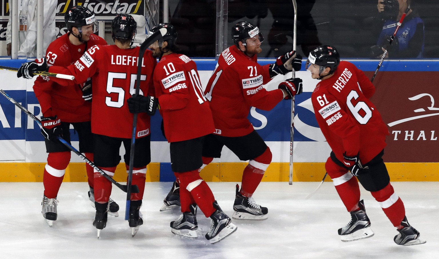 epa05964654 Team switzerland celebrates after Fabrice Hertzog of Switzerland scored during the IIHF Ice Hockey World Championship 2017 group B preliminary round game between Switzerland and Finland in ...