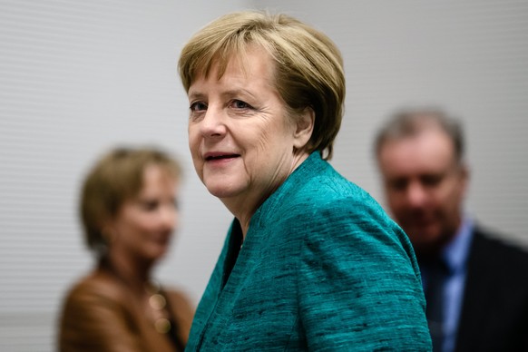 epa06503230 German Chancellor and Chairwoman of the Christian Democratic Union (CDU), Angela Merkel, arrives for a faction meeting after coalition talks, in Berlin, Germany, 07 February 2018. The lead ...