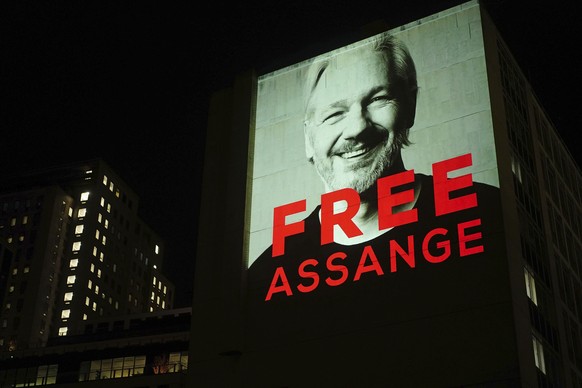 An image of Julian Assange is projected onto a building in Leake Street in central London on Sunday, April 10, 2022, to mark three years since his arrest and detention in Belmarsh prison while the Uni ...