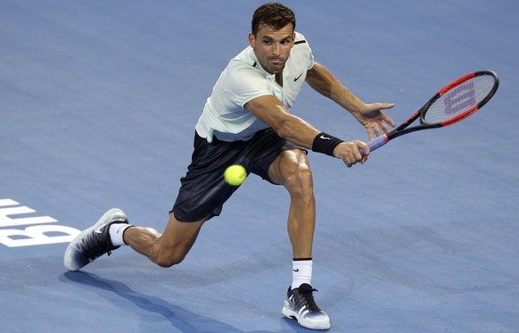 Grigor Dimitrov of Bulgaria plays a shot in his quarter final match against Kyle Edmund of Britain during the Brisbane International tennis tournament in Brisbane, Australia, Friday, Jan. 5, 2018. (AP ...