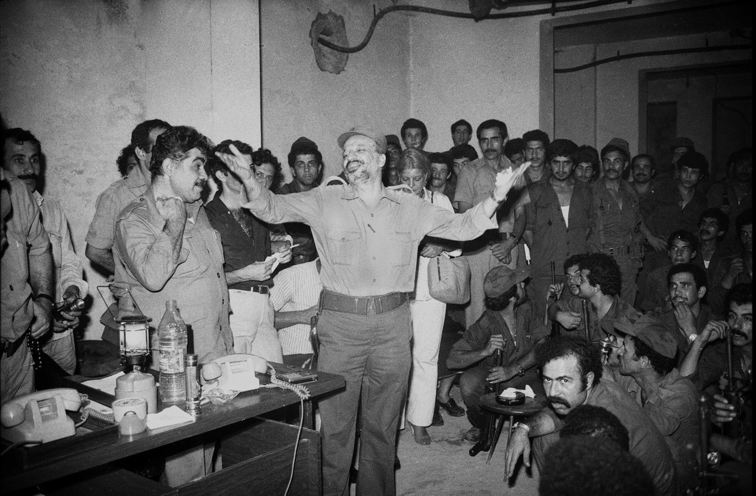 Chairman of the Palestine Liberation Organization Yasser Arafat, center, addresses his officers at a farewell gathering in West Beirut, Lebanon, in August 21, 1982. (KEYSTONE/AP Photo/Mourad Abdel Rao ...