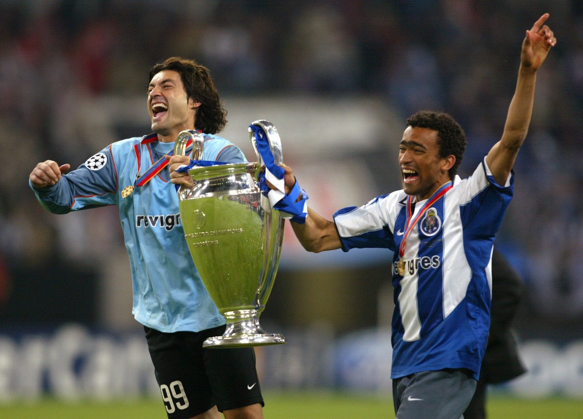 Porto players Vitor Baia, left, and Bosingwa celebrate with the trophy after beating Monaco 3-0 to win the UEFA Champions League Final in the 'Arena AufSchalke' in Gelsenkirchen, Germany, We ...