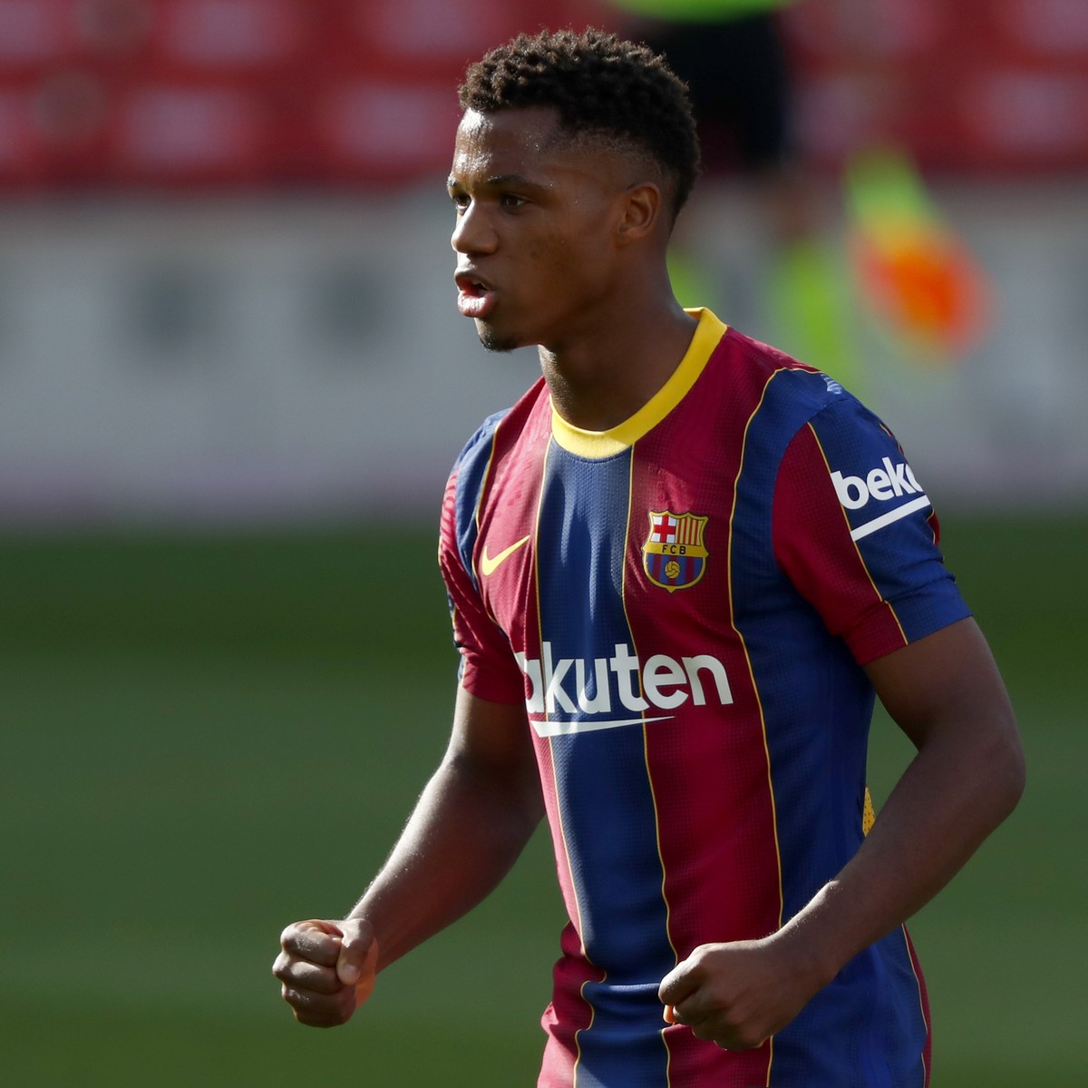 Barcelona's Ansu Fati celebrates scoring his side's first goal during the Spanish La Liga soccer match between FC Barcelona and Real Madrid at the Camp Nou stadium in Barcelona, Spain, Satur ...