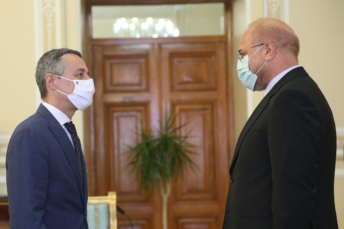 epa08650249 A handout photo made available by the Iranian Parliament official website (ICANA) shows, Iranian parliament speaker Mohammad Bagher Ghalibaf (R) greets Swiss Federal Councillor Ignazio Cas ...
