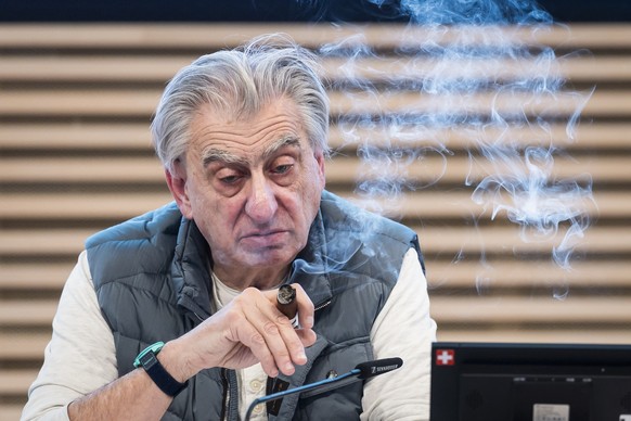 KEYPIX - Nick Hayek, CEO Swatch Group AG, smokes a cigar during a press conference to present the annual results for 2025, Wednesday, March 18, 2026, in Biel, Switzerland. (KEYSTONE/Peter Klaunzer)