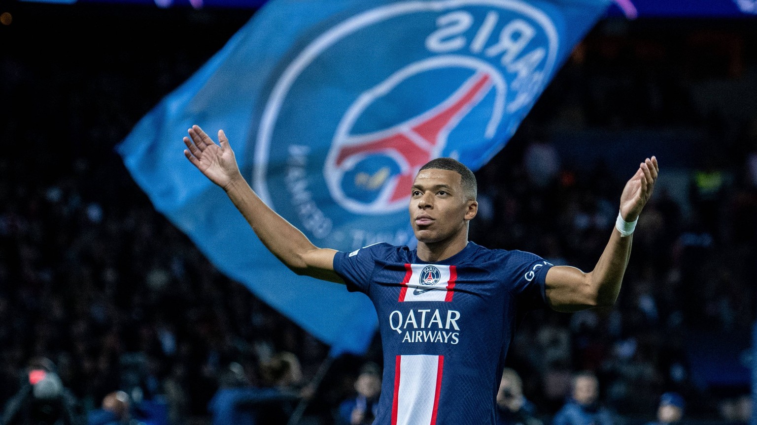 PARIS, FRANCE - OCTOBER 11: Kylian Mbappe of Paris Saint-Germain celebrates after scoring opening goal during the UEFA Champions League group H match between Paris Saint-Germain and SL Benfica at Parc ...