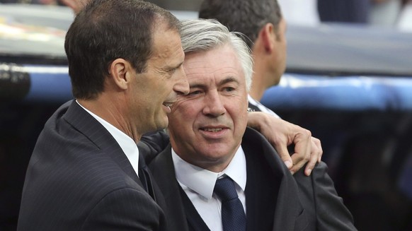 epa04747082 Real Madrid&#039;s Italian head coach Carlo Ancelotti (R) embraces Jueventus FC&#039;s head coach Massimiliano Allegri (L) before the UEFA Champions League semi final second leg soccer mat ...