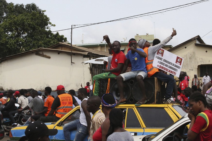 People protest on the streets of Conakry, Guinea, Thursday, Oct. 24, 2019. Some thousands of people marched Thursday in the streets of Guinea's capital protesting a bid by the president to seek anothe ...