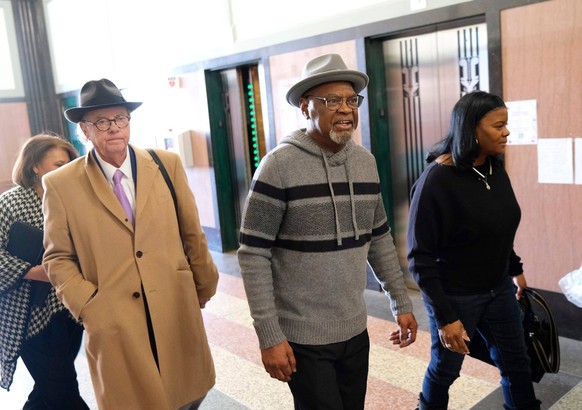 Syndication: Oklahoman Glynn Simmons, center, arrives with one of his attorneys, John Coyle, and his cousin, Cecilia Hawthrone for the hearings Judge Amy Palumbo ruled to approve Glynn Simmons...