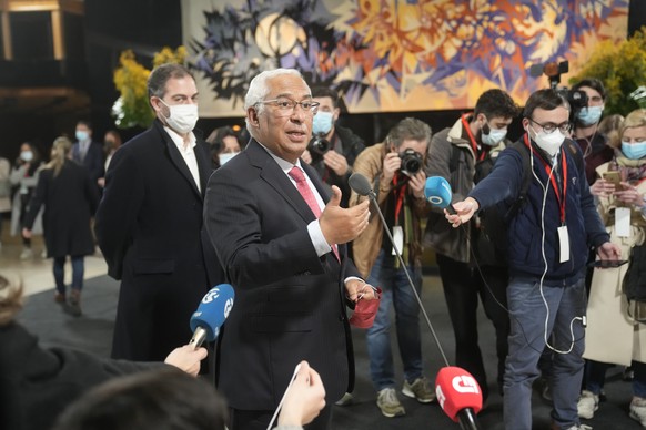 Portuguese Prime Minister and Socialist Party Secretary General Antonio Costa speaks to journalists after arriving at a hotel to wait for the election results in Lisbon, Sunday, Jan. 30, 2022. Portugu ...